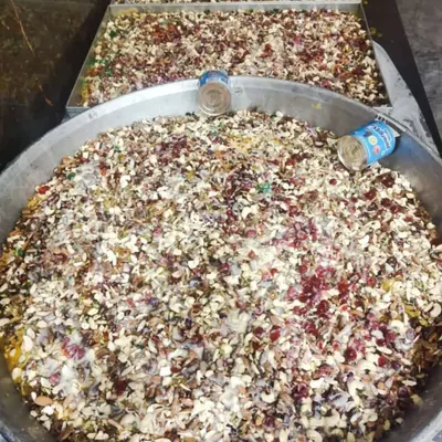 Huge platters of our special sweet dish, likely Shahi Tukda or a bread pudding, loaded with nuts and tutti-frutti.