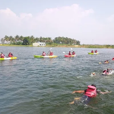 Participants enjoy a swim and kayak session in the calm waters of Ambigarahalli, a perfect location for our basic aqua sports courses.