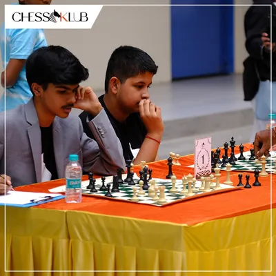 Deep in concentration during a simultaneous chess match at our Chess Carnival. Events like these challenge our students to think on their feet against experienced players.