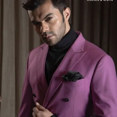 Luxury, tailored with intent. This double-breasted magenta suit paired with a black turtleneck is for those who understand that distinction doesn’t need to shout. This is Minimal Authority, where elegance is engineered.