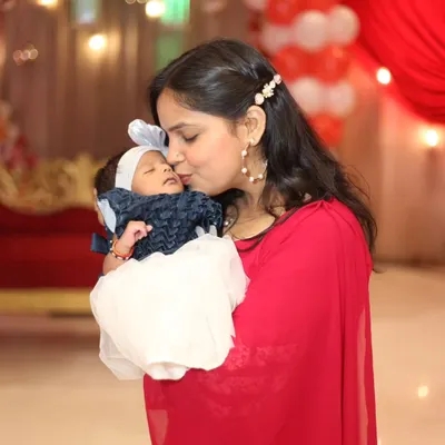 A mother's gentle kiss for her sleeping baby. These are the moments of pure love that I aim to capture in every family photoshoot.