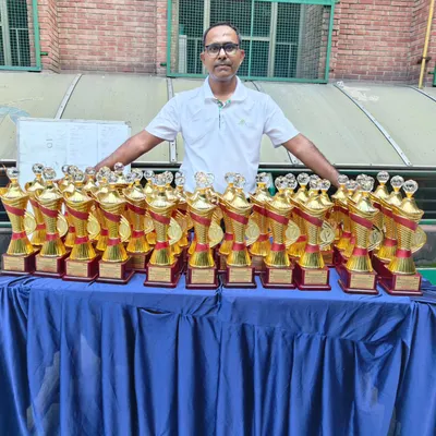 Trophies lined up and ready for the deserving champions at the GGems Inter-school Squash Tournament. Recognizing the hard work of every participant is a cornerstone of our events.