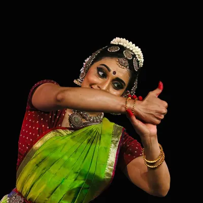 A close-up capturing the playful mischief and storytelling of abhinaya, from a performance at the Krishna Gana Sabha Pongal Dance Festival.