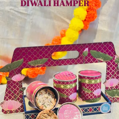 My premium three-jar Diwali hamper is perfect for corporate or family gifting. It includes our signature 7-Seeds Nuts Cookies, Artisanal Truffle Cubes, and Toasted Almond Stacks in a reusable decorative tray.