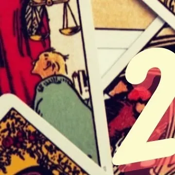 A close-up detail of tarot cards, showcasing the intricate artwork and symbolism that I interpret during a reading.