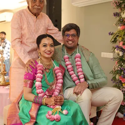 A beautiful three-generation family portrait. We had the pleasure of dressing this family, from the grandfather's simple peach kurta to the groom's elegant green kurta, ensuring everyone felt comfortable and stylish.