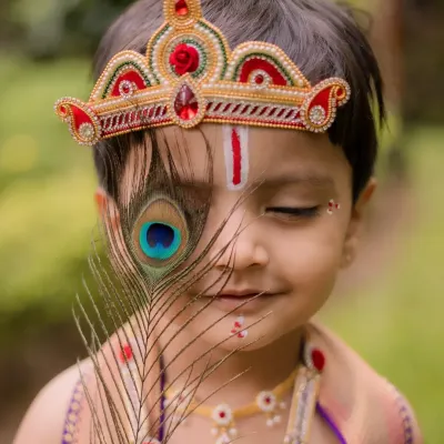 This artistic portrait from a Little Krishna themed shoot is one of my favorites. The way the peacock feather gently covers his eye creates a sense of innocence and divinity, making it a truly special memory for his family.