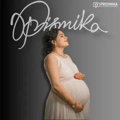 This classic studio portrait is all about capturing your serene pregnancy glow. The simple white dress and minimalist background put the focus entirely on you and the beautiful life you are creating.