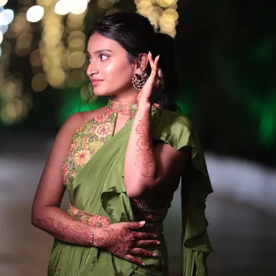 A beautiful look for the sister of the bride. She is wearing a modern Indo-Western saree, so we opted for minimal makeup with a dewy finish and a stylish ponytail.