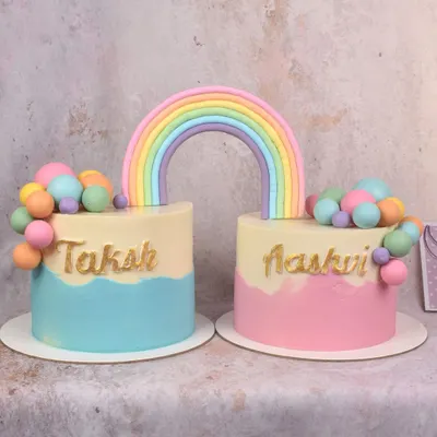 For a joint birthday celebration for twins, I made two separate cakes connected by a single rainbow topper. A sweet way to give each child their own cake while celebrating together.