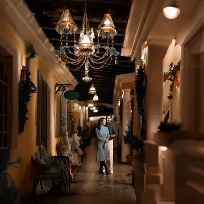 The right location can transport you. This elegant, warmly lit corridor gave Atul and Rachita's pre-wedding shoot a timeless, almost European feel. I love using architectural details and ambient light to create a mood of sophisticated romance.