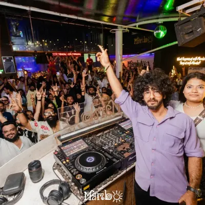 A full house at Cafe Mambo. This view from my DJ booth shows a packed club with everyone's hands in the air, a typical scene from one of my weekend nights.