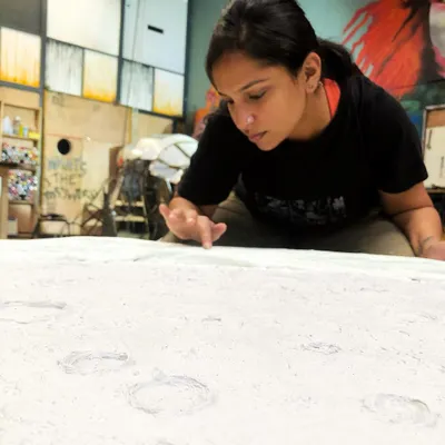 Here I am, completely absorbed in creating the textured surface of my moon sculpture. This work-in-progress shot captures the focus and hands-on detail that goes into every piece. I'm clearly over the moon!