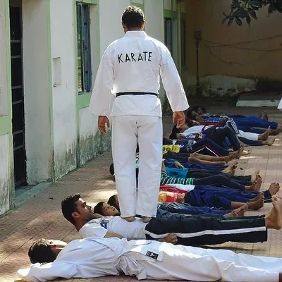 This is my guru, demonstrating a trust and strength exercise. He is the heart of our academy, and his teachings guide us all.