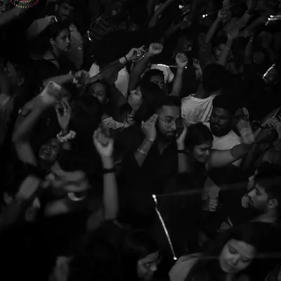 A black and white shot capturing the pure joy of the crowd, lost in the music. This is the kind of moment I strive to create every night.