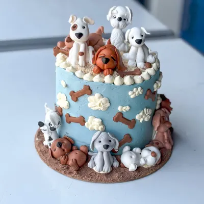 This cake is one of my all-time favorites, made for a true dog lover. It features a variety of handmade fondant dog figurines, each with its own personality, sitting on and around a buttercream cake. It’s a perfect example of how we can turn your passion into a delicious piece of edible art.