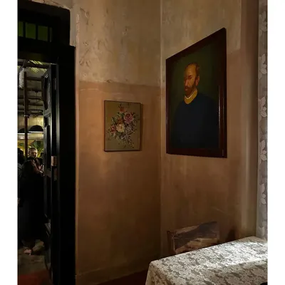 It gives me immense happiness to see a space I designed, like The Lovefools restaurant, thriving with people celebrating and enjoying the vibe. This moody corner with vintage art captures the romantic, soulful atmosphere we created.