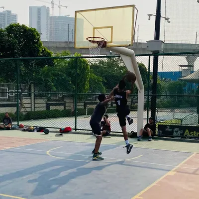 A player executes a jump shot over a defender. We teach players how to create space and get their shot off even when contested.