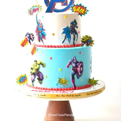 An action-packed two-tier Avengers theme cake. I decorated this Oreo Cream o Cookie cake with edible prints of Hulk, Captain America, Superman, and Batman, complete with fun "BAM!" and "POW!" toppers for a true comic book feel.