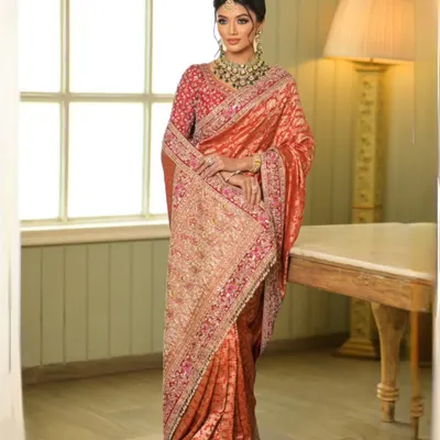 This Banarasi Kadwa handloom saree is a work of art. I draped it with a double dupatta to create a regal and layered look, perfect for a bride who wants to blend tradition with high fashion.