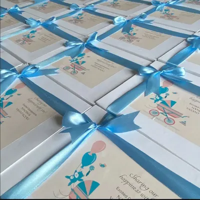 Announce your bundle of joy with these adorable baby announcement hampers. These white boxes, tied with a beautiful blue satin ribbon, are a sweet way to share your happiness.