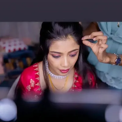 A glimpse into my process. Here I am styling the hair for Vasudha's reception look, ensuring every detail is perfect.
