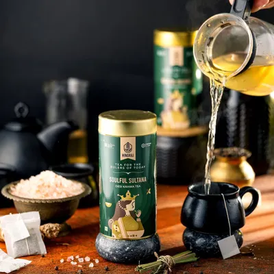 A dynamic pour of green tea into a black mug for Hindraj Tea. The action shot captures the steam and movement, bringing the simple act of making tea to life in a dark and moody setting.