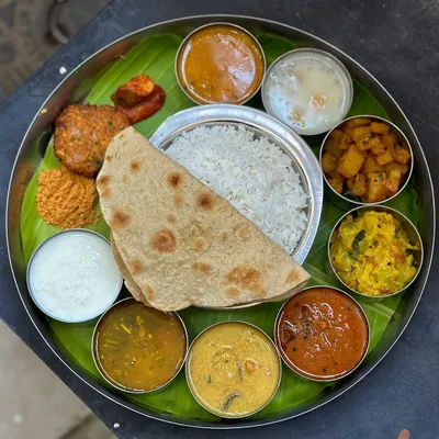 A real, unedited look at our magnificent South Indian lunch thali. A complete, authentic, and hearty meal with a dozen different items to savor.