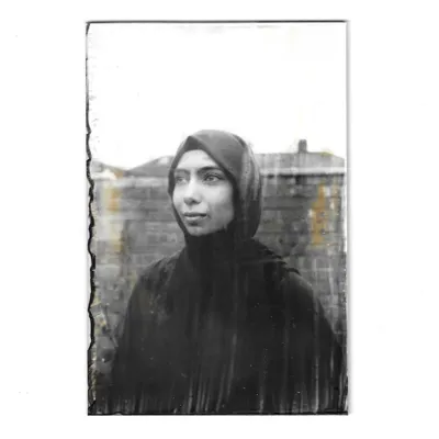 A portrait of Mashal, created using the 19th-century wet plate collodion process. This technique produces a one-of-a-kind ambrotype on a 4x6 inch glass plate, characterized by its monochrome tones and unique imperfections that are part of the analogue art form.