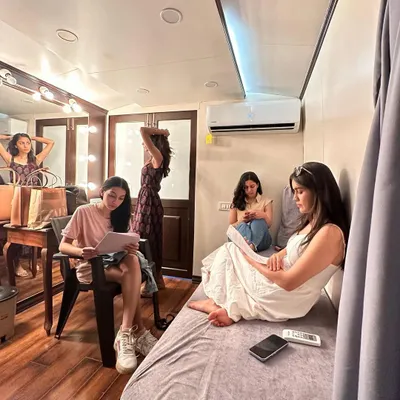 A candid moment in the vanity van with the cast of 'Dange/Por'. These moments of rest and preparation between intense scenes are where we all bonded.