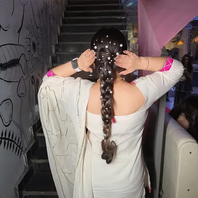 Hair in focus. A beautiful pearl-studded braid for a sangeet night. This style is both traditional and modern.