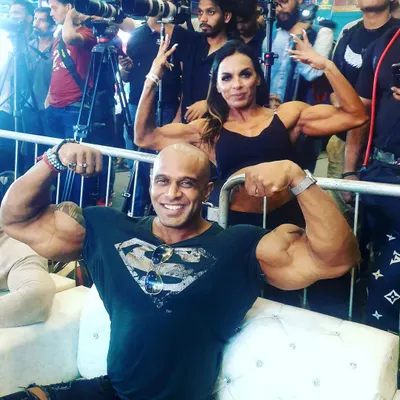 With a fellow bodybuilder, sharing our passion for muscle. The fitness community is a great source of motivation and support.