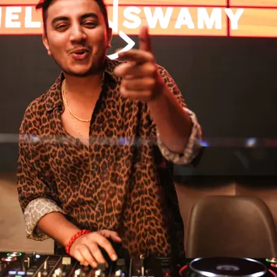 Pointing to the crowd, making a direct connection. I make sure everyone feels seen and included in the party. Your energy fuels my performance.