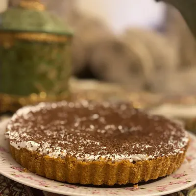 My classic Banoffee Pie, with a biscuit crust, a layer of toffee and bananas, and topped with fresh cream and chocolate shavings.