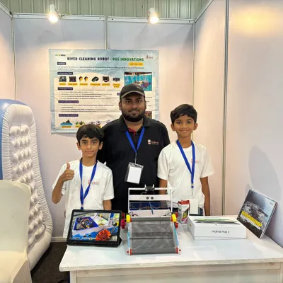Here are our young engineers, Surya and Ronit, proudly presenting their award-winning AI River Cleaning Robot. They used an Arduino and an AI camera to design a solution for a real environmental issue.