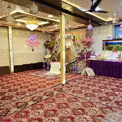 Our elegant banquet hall, decorated and ready for a celebration. We offer this fully air-conditioned space at reasonable charges for weddings, nikahs, and all your special gatherings.
