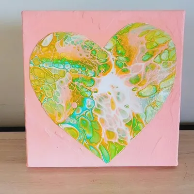 This fluid art heart was one of the first in the series. The idea came to me during Covid, as a way to send some love out into the world. The way the green, yellow, and pink paints interact creates a beautiful, organic pattern.