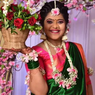 The perfect 'Mom To Be' glow. This beautiful client is wearing a custom set with pink roses and baby's breath, complete with a necklace, maang tikka, and hathphool for her baby shower.
