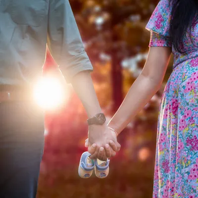 Sometimes the smallest details tell the biggest story. A simple prop like a pair of baby shoes held between an expecting couple adds a layer of sweet anticipation to your maternity photoshoot.