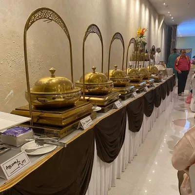 This is our complete buffet setup for a Mata ki Chowki in Powai, featuring an extensive menu of Jain and Satvik dishes. We ensure clear labeling and authentic preparation for all religious events.