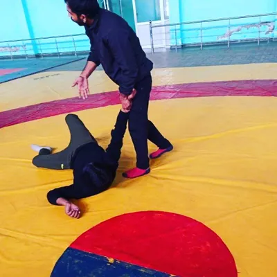 A look at our wrestling and grappling training. Here, a student learns how to execute a takedown and control an opponent on the mat.