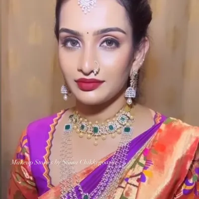 The beautiful Shravya, ready for her event. We chose a modern look with diamond and emerald jewelry, paired with a flawless base and a striking red lip.