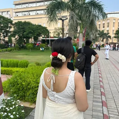 A client looking absolutely stunning with my reusable crochet gajra in her hair. It's the perfect accessory for traditional wear, adding a touch of handmade elegance.