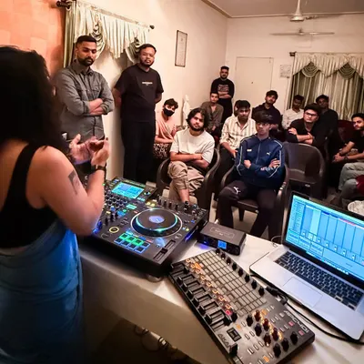 A typical workshop scene. I’m explaining my setup, which includes Pioneer CDJs, a laptop running Ableton, and an APC40 controller. It’s an open floor for questions, where we discuss everything from technical skills to creative mindset.