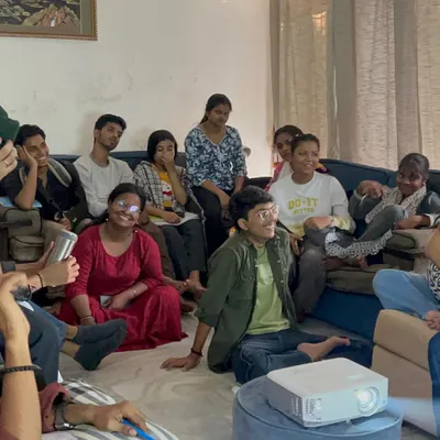 Our 'Teacher to Facilitator' training in session. Fellows watch a presentation, learning new techniques to go beyond traditional teaching and create more engaging, student-centered environments.
