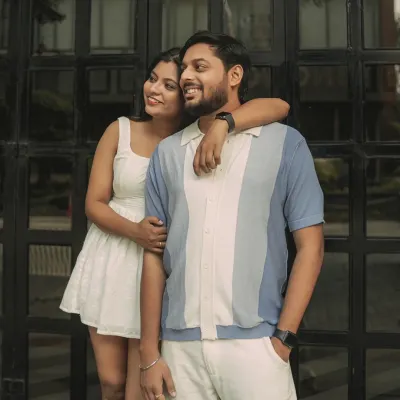 A relaxed and stylish portrait against a modern, graphic background. This shot captures the cool, contemporary vibe of an urban couple shoot in Bangalore.