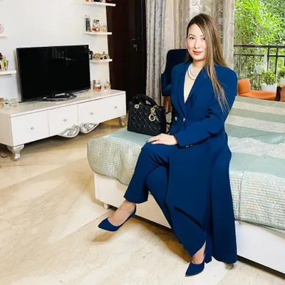 We believe that what you wear should feel like an extension of you. This client is wearing our navy trench suit, a perfect example of our bespoke formal wear. Notice the clean lines, the structured shoulders, and the way the fabric drapes, all achieved through a meticulous pattern-making and fitting process.