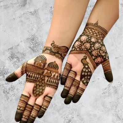 A beautiful design featuring palace architecture and peacock motifs on the palms, perfect for a wedding guest or for a festive occasion.