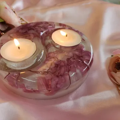 Shipping this beauty to New Delhi today. This is a close-up of the pearl white and pink flower resin tealight holder, with the candles lit. It gives off such a warm, beautiful light.