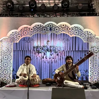 A classic sitar and tabla jugalbandi at the iconic Taj Mahal Palace, Mumbai. This setup is ideal for creating an atmosphere of elegance and sophistication, perfect for exclusive gatherings and wedding events.